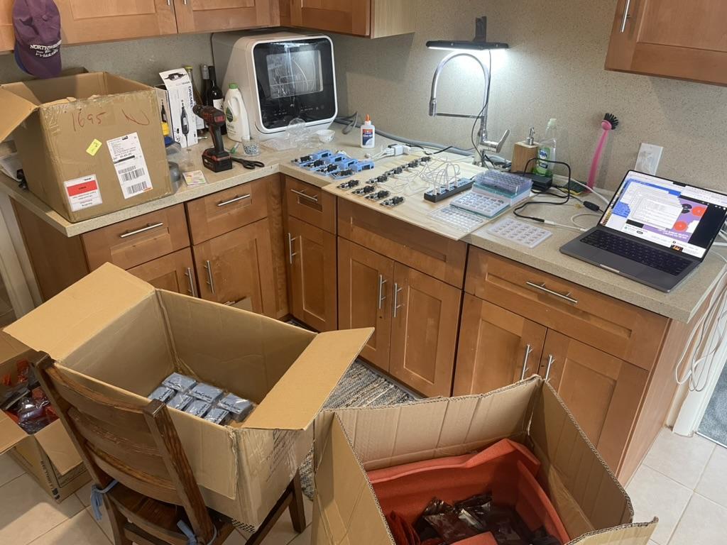 Jamcorders being assembled and packed in a kitchen